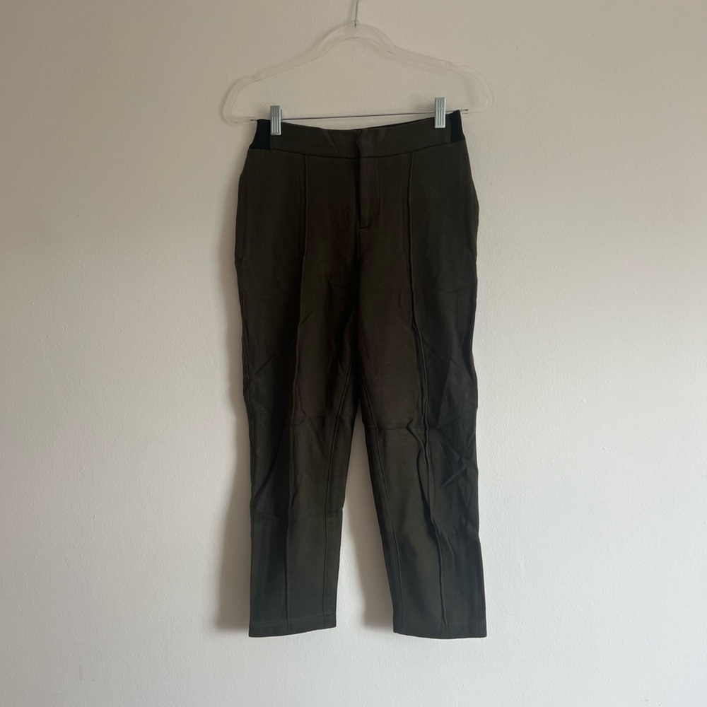 OG green KITH riding pants with logo detail on waist